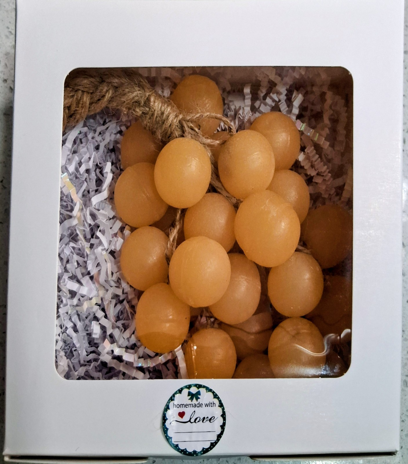 Handcrafted clear glycerin soaps shaped like grape clusters