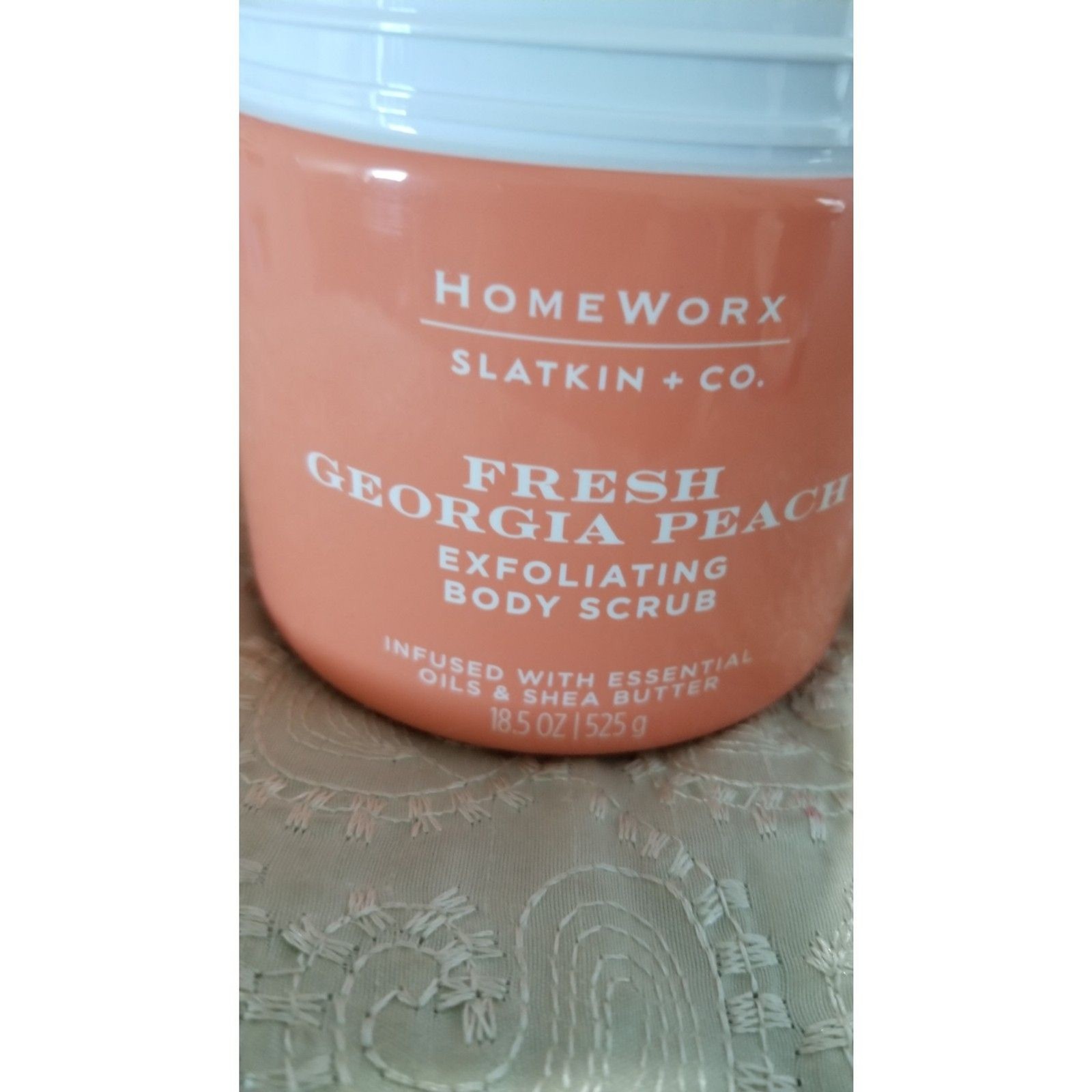 The Homeworx Fresh Georgia Peach Body Scrub by Slatkin + Co. is a, 18.5-oz